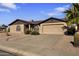 Single-story home featuring a two-car garage and desert landscaping for low maintenance at 1459 S Mara Dr, Apache Junction, AZ 85120