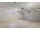 Spacious two car garage featuring two overhead doors and a window at 1459 S Mara Dr, Apache Junction, AZ 85120