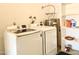 Laundry room featuring modern Samsung washing machine and dryer with storage shelves at 1459 S Mara Dr, Apache Junction, AZ 85120