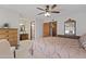A main bedroom with an ensuite bathroom, ceiling fan, and ample natural light at 1459 S Mara Dr, Apache Junction, AZ 85120
