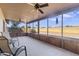 Enclosed screened patio providing an outdoor living space with views of the backyard at 1459 S Mara Dr, Apache Junction, AZ 85120