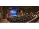 Spacious auditorium with ample seating, a stage with curtains, and professional lighting at 15516 W Verde Ln, Goodyear, AZ 85395