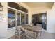 Cozy back patio with neutral furniture, perfect for outdoor dining and enjoying the views at 15516 W Verde Ln, Goodyear, AZ 85395