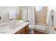 Clean bathroom features a shower-tub combo, vanity with sink and great lighting at 15516 W Verde Ln, Goodyear, AZ 85395
