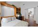 Comfortable bedroom with a built-in desk, shelving, and neutral decor at 15516 W Verde Ln, Goodyear, AZ 85395