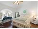 Bright bedroom with a large bed, vintage decor and hardwood floors at 15516 W Verde Ln, Goodyear, AZ 85395
