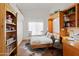 Bright bedroom features a built-in desk, shelving, and cozy decor at 15516 W Verde Ln, Goodyear, AZ 85395
