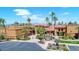 Aerial view of the impressive community clubhouse surrounded by palm trees and manicured landscaping at 15516 W Verde Ln, Goodyear, AZ 85395