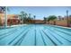 An outdoor pool with marked lanes sits under a bright blue sky at 15516 W Verde Ln, Goodyear, AZ 85395