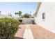 Side yard showcasing the desert landscape, providing a private and serene outdoor space at 15516 W Verde Ln, Goodyear, AZ 85395