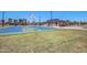 Outdoor basketball court features well-maintained hoops, a smooth surface, and surrounding green space, ideal for sports enthusiasts at 15604 N 173Rd Ln, Surprise, AZ 85388