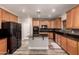 Modern kitchen with stainless steel appliances, center island, and beautiful countertops at 15604 N 173Rd Ln, Surprise, AZ 85388