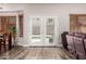 Bright living space showcasing a modern interior, with doors that provide backyard views and natural light at 15604 N 173Rd Ln, Surprise, AZ 85388
