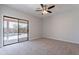 Spacious bedroom featuring a sliding glass door leading to the outdoor pool area at 15903 N 138Th Ave, Surprise, AZ 85374