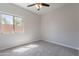 Neutral bedroom featuring carpet floors, ceiling fan and natural light at 15903 N 138Th Ave, Surprise, AZ 85374