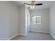This bedroom has neutral walls, carpet, standard closet, and a ceiling fan at 15903 N 138Th Ave, Surprise, AZ 85374