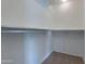 Walk-in closet with built-in shelving for organized storage at 15903 N 138Th Ave, Surprise, AZ 85374