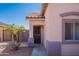 Close up of house entrance with security door and desert landscaping with rock ground cover at 15903 N 138Th Ave, Surprise, AZ 85374