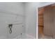 Laundry room features tile flooring, storage, and access to the garage at 15903 N 138Th Ave, Surprise, AZ 85374