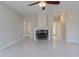 This spacious living room features tile floors and a modern fireplace at 15903 N 138Th Ave, Surprise, AZ 85374