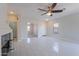Bright living room with tile flooring and modern finishes including fireplace at 15903 N 138Th Ave, Surprise, AZ 85374