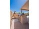 Built-in outdoor kitchen with a stainless steel BBQ, perfect for summer gatherings by the pool at 15903 N 138Th Ave, Surprise, AZ 85374