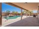 View of pool, patio, and landscaping from the covered patio area at 15903 N 138Th Ave, Surprise, AZ 85374