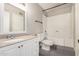 Bathroom features white cabinets, a large mirror and tub with shower at 1616 S Torre Molinos Cir, Tempe, AZ 85281