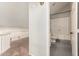Hallway leading to bathroom features carpeted floor and white railing at 1616 S Torre Molinos Cir, Tempe, AZ 85281