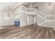 Open floor plan with hardwood floors and a loft above the living area at 1616 S Torre Molinos Cir, Tempe, AZ 85281