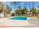 Refreshing community pool surrounded by mature palm trees, provides a tranquil and tropical retreat at 1616 S Torre Molinos Cir, Tempe, AZ 85281