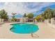 Community pool surrounded by lush landscaping, providing a perfect spot for relaxation and recreation at 1616 S Torre Molinos Cir, Tempe, AZ 85281