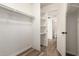 A bright walk-in closet featuring white shelving and vinyl floors at 1616 S Torre Molinos Cir, Tempe, AZ 85281