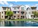 Charming three-story home with stone accents overlooking a beautiful pond and fountain at 1661 E Hampton Ln, Gilbert, AZ 85295