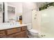 Bathroom featuring a shower, vanity, and toilet at 16670 N 109Th Way, Scottsdale, AZ 85255