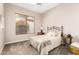 Bedroom featuring a bed, neutral paint, ceiling fan and bright window at 16670 N 109Th Way, Scottsdale, AZ 85255