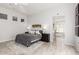 Airy bedroom offers a cozy bed, stylish decor, and a view of the adjacent bathroom at 16670 N 109Th Way, Scottsdale, AZ 85255