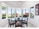 Bright breakfast nook with curved windows that offer views of the backyard landscaping at 16670 N 109Th Way, Scottsdale, AZ 85255