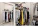 Walk-in closet with shelving and plenty of storage for clothes and accessories at 16670 N 109Th Way, Scottsdale, AZ 85255