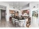 Spacious kitchen with dark countertops, stainless steel appliances, pendant lighting and breakfast bar at 16670 N 109Th Way, Scottsdale, AZ 85255