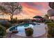Lush backyard featuring a sparkling pool, mature landscaping, and desert views at 16670 N 109Th Way, Scottsdale, AZ 85255
