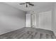 Inviting bedroom with carpet, ceiling fan, and access to bathroom and closets, blending comfort and convenience at 17242 N 16Th Dr # 6, Phoenix, AZ 85023