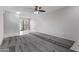 Neutral living room featuring gray carpeting, a dining area, and tile floors at 17242 N 16Th Dr # 6, Phoenix, AZ 85023