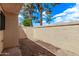 Private patio is a tranquil retreat, featuring a secure gate and exterior lighting for both beauty and peace of mind at 17242 N 16Th Dr # 6, Phoenix, AZ 85023
