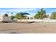 A community playground with shade covering and outdoor games, within a fenced recreation area at 17242 N 16Th Dr # 6, Phoenix, AZ 85023