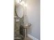 Stylish bathroom with a unique glass bowl sink and modern fixtures adding a touch of elegance at 1731 E Evans Dr, Phoenix, AZ 85022
