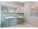 Modern bathroom featuring double sinks, stylish tile work, a large mirror, and a towel warmer at 1731 E Evans Dr, Phoenix, AZ 85022