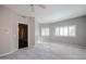 Bright bedroom featuring neutral walls, plush carpet, recessed lighting, and large windows with views at 1731 E Evans Dr, Phoenix, AZ 85022