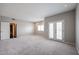Comfortable bedroom features plush carpeting, large windows, and convenient access to an adjacent room at 1731 E Evans Dr, Phoenix, AZ 85022