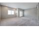 Inviting bedroom with plush carpeting, plantation shutters, and access to the outdoors via French doors at 1731 E Evans Dr, Phoenix, AZ 85022